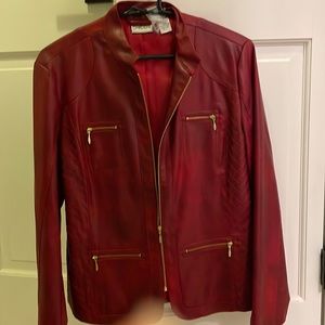 NWOT Chico’s leather-look jacket with gold zipper detail.